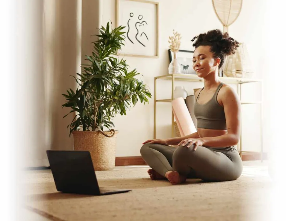A client relaxing during an online wellness coaching session